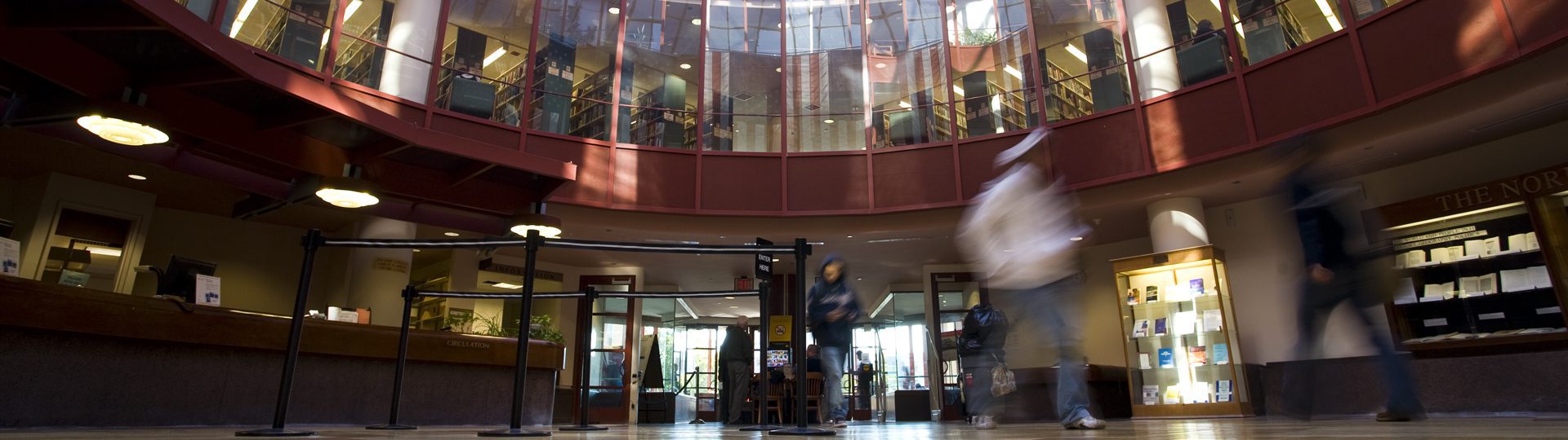 People walking in Benjamin S. Rosenthal Library.